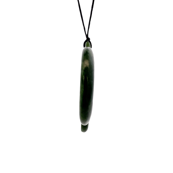 NZ pounamu greenstone flower jade polished manaia on slider cord by Aden Hoglund