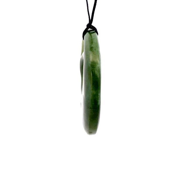 NZ pounamu greenstone medium round with koru pendant on slider cord by Aden Hoglund