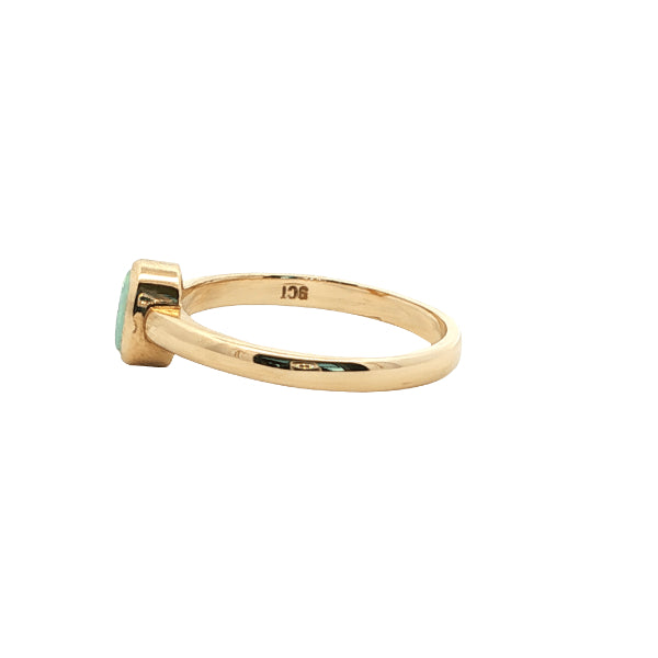 White oval opal rubover ring n 9ct yellow gold