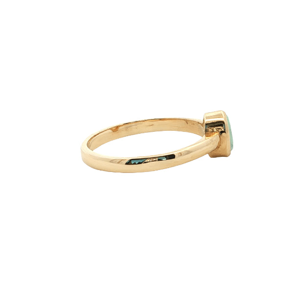 White oval opal rubover ring n 9ct yellow gold