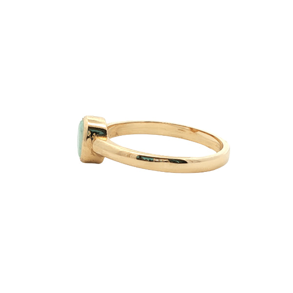 White oval opal rubover ring n 9ct yellow gold