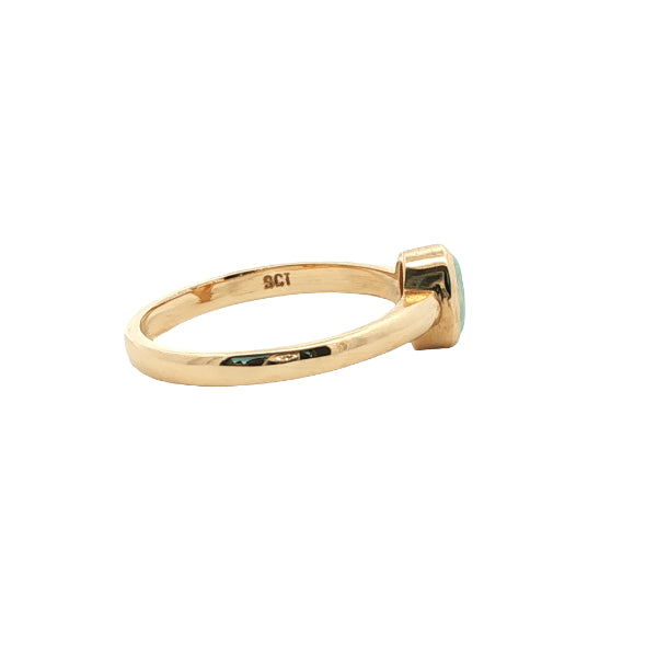 White oval opal rubover ring n 9ct yellow gold