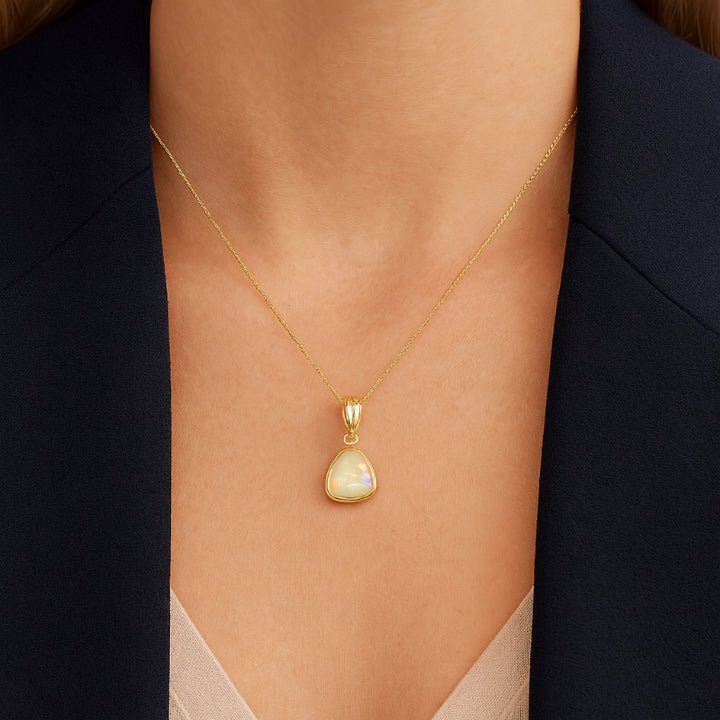 Triangular australian opal pendant in 9ct yellow gold