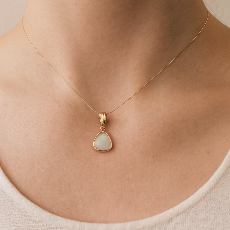 Triangular australian opal pendant in 9ct yellow gold