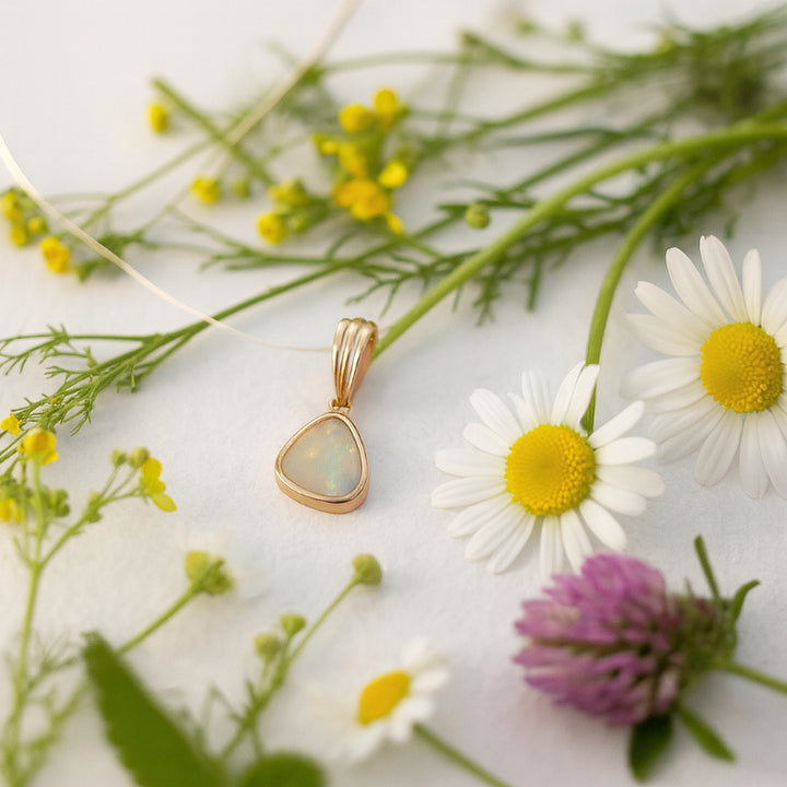 Triangular australian opal pendant in 9ct yellow gold