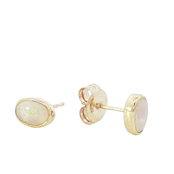Oval Australian opal rubover stud earrings in 9ct yellow gold
