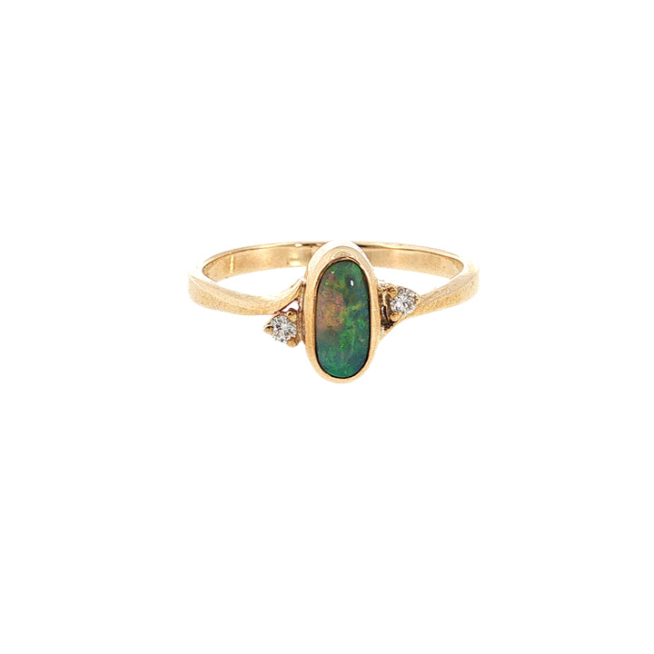 Australian opal rubover set ring with two diamonds in 9ct yellow gold.