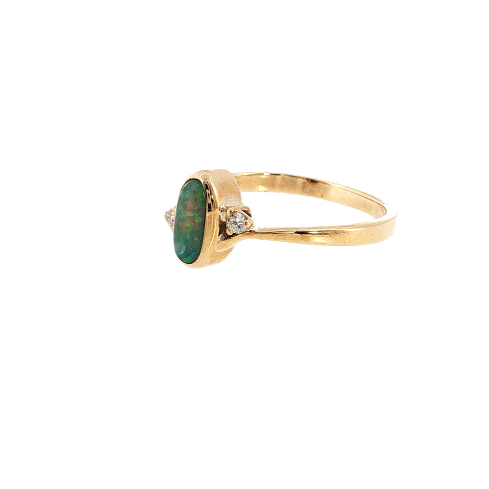 Australian opal rubover set ring with two diamonds in 9ct yellow gold.