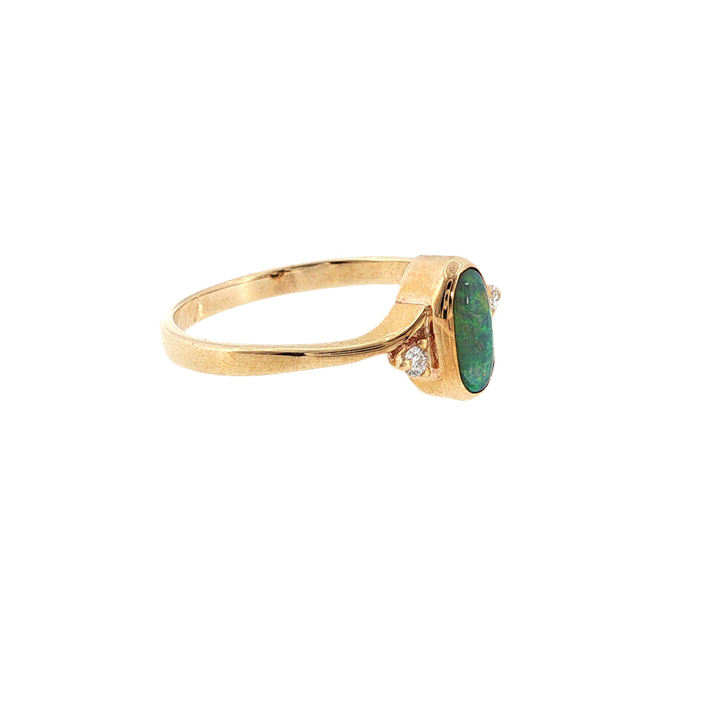 Australian opal rubover set ring with two diamonds in 9ct yellow gold.