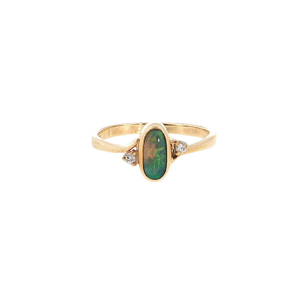 Australian opal rubover set ring with two diamonds in 9ct yellow gold.