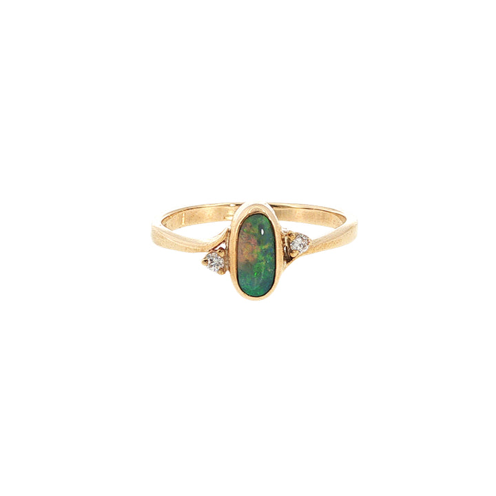 Australian opal rubover set ring with two diamonds in 9ct yellow gold.