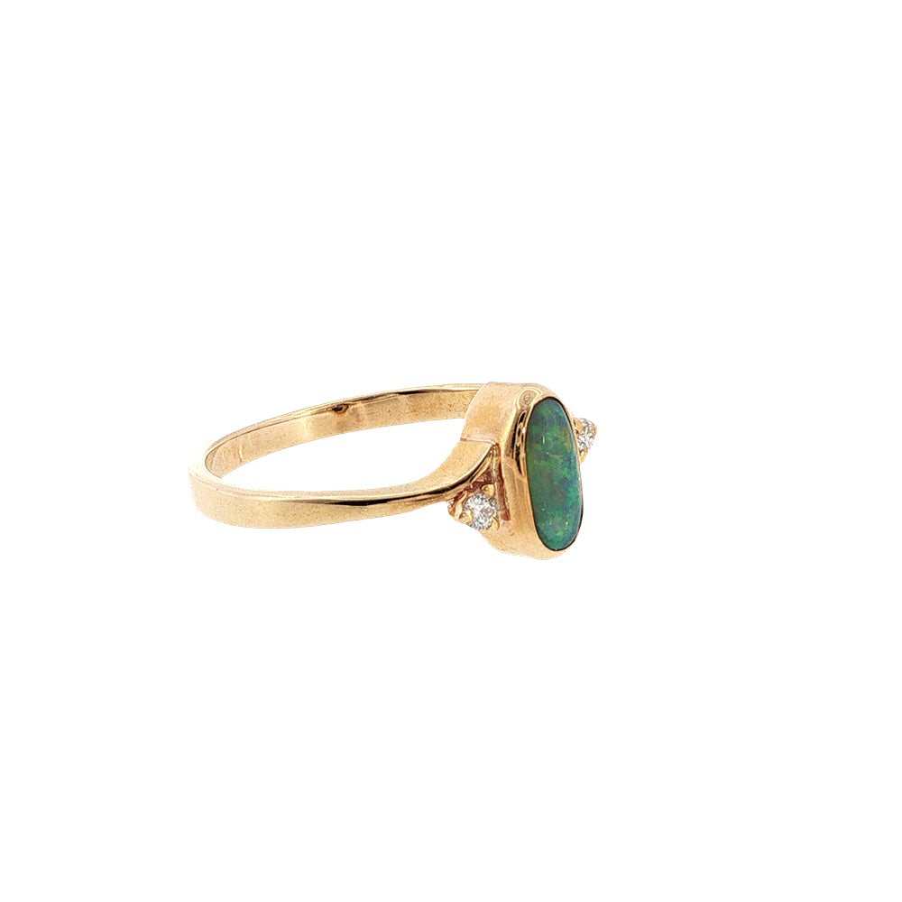 Australian opal rubover set ring with two diamonds in 9ct yellow gold.