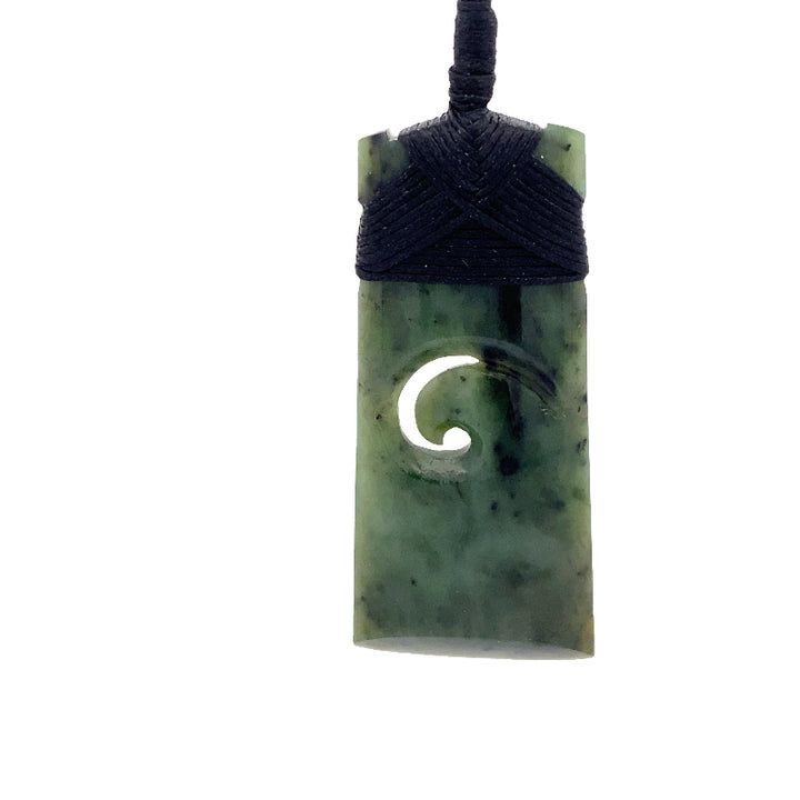NZ pounamu greenstone toki with koru pendant on plaited slider cord