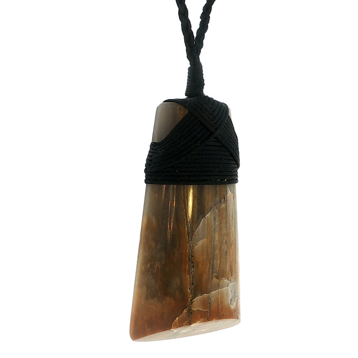 Petrified wood bound toki pendant on slider cord