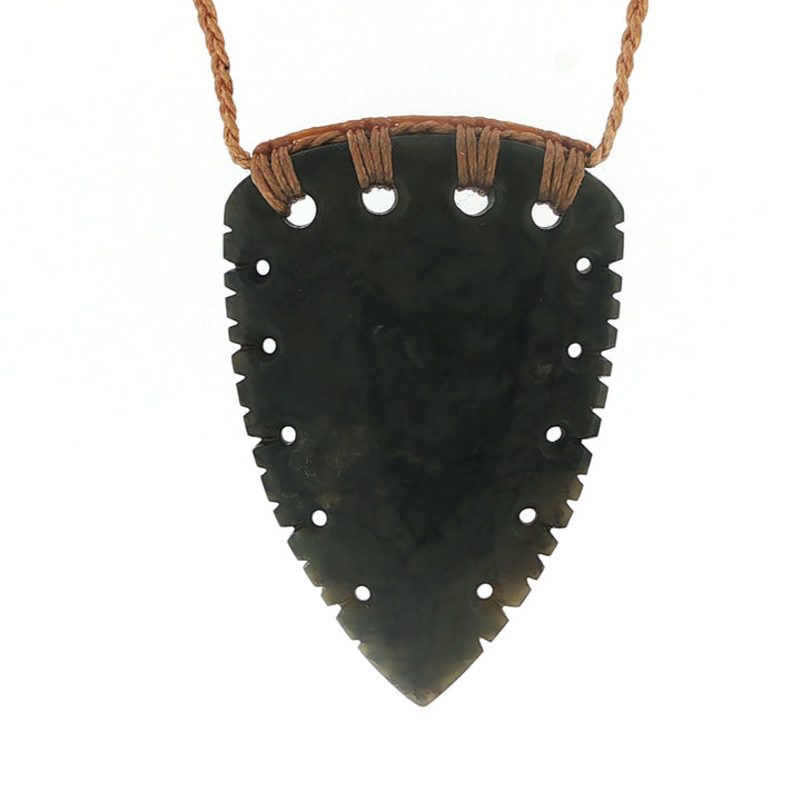 NZ pounamu greenstone notched rei niho or whales tooth pendant on plaited tan slider cord