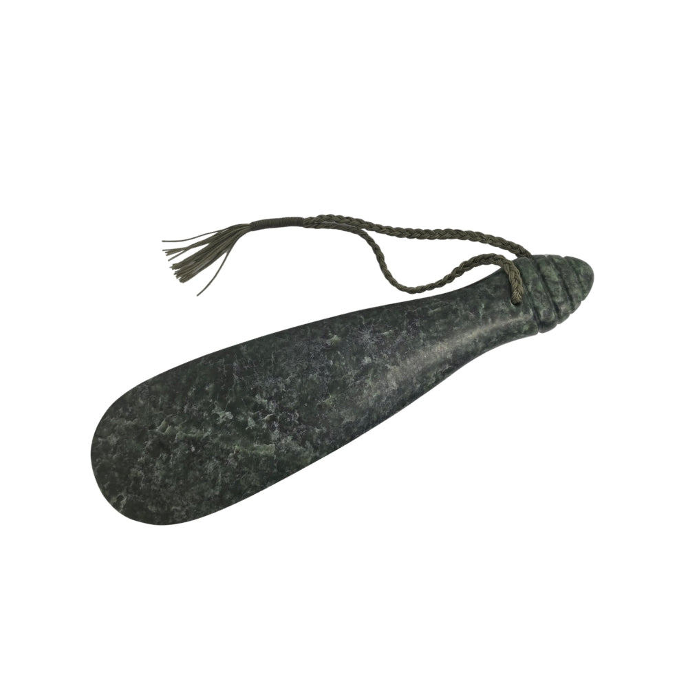 NZ pounamu greenstone mere with green cord and wooden stand