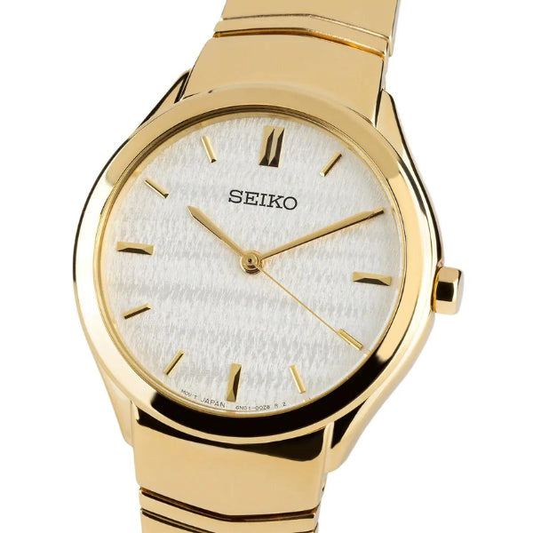 Seiko women's quartz dress watch in gold tone and champagne dial