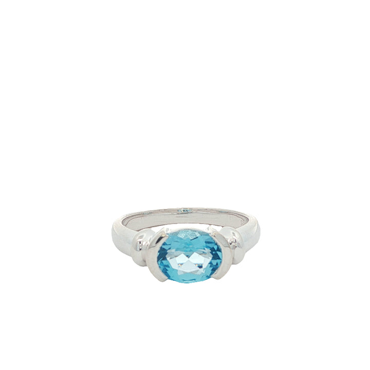 Oval blue topaz semi rubover ring in sterling silver