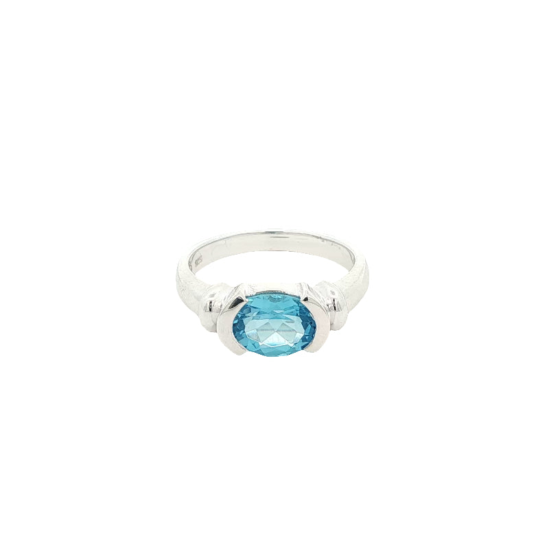 Oval blue topaz semi rubover ring in sterling silver