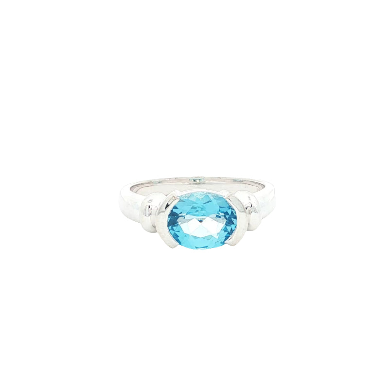 Oval blue topaz semi rubover ring in sterling silver