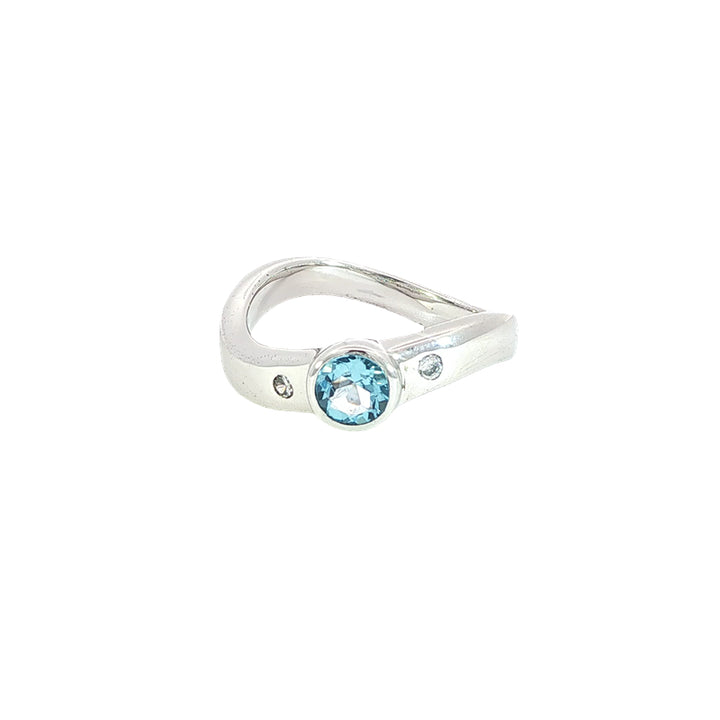 Swiss blue topaz and cz ring on curved band in sterling silver