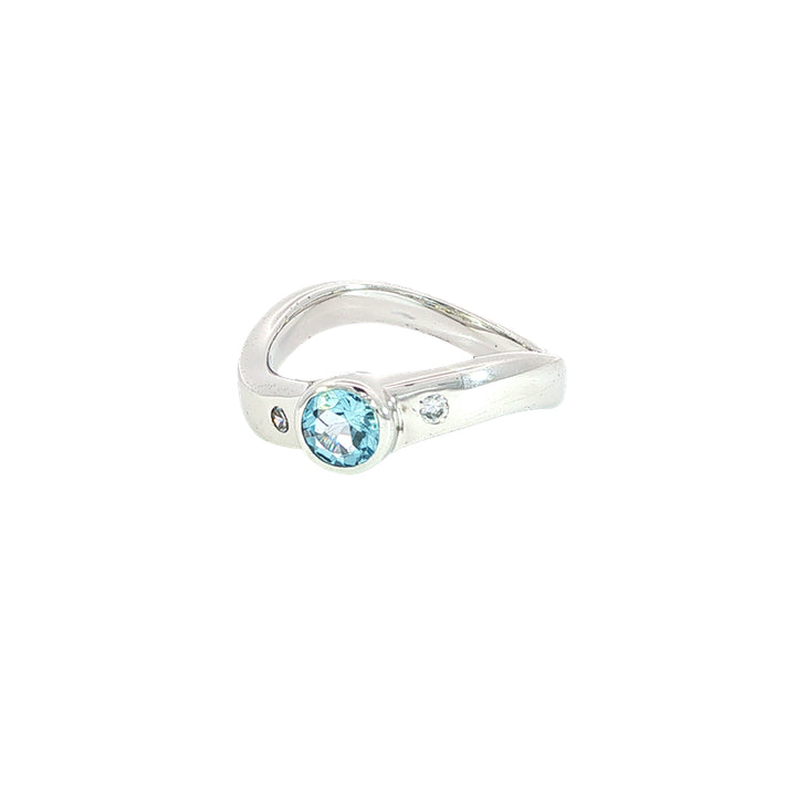 Swiss blue topaz and cz ring on curved band in sterling silver