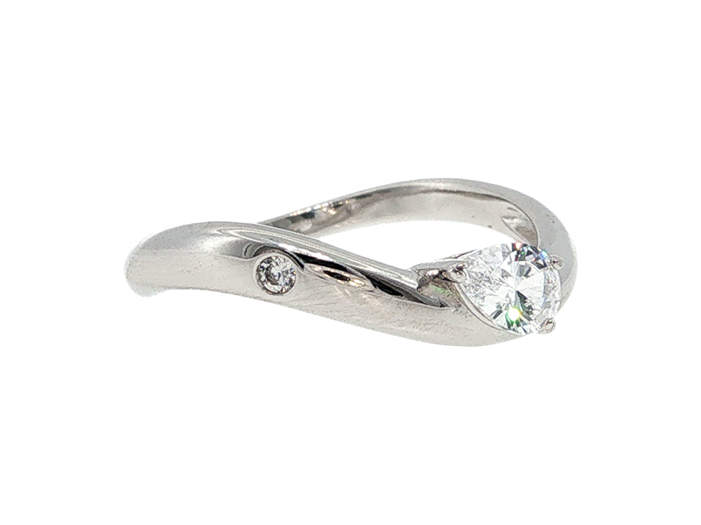 Curved ring with pear cz and bezel set cz in sterling silver