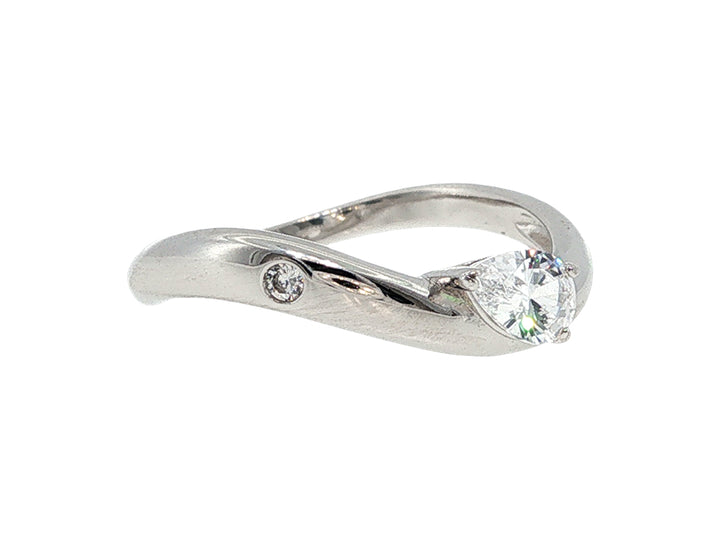 Curved ring with pear cz and bezel set cz in sterling silver