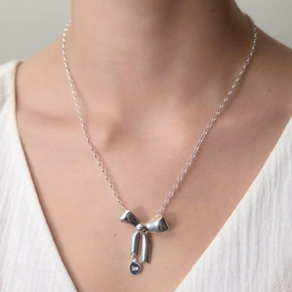 Karen Walker signature bow necklace in sterling silver with oval belcher chain - 45cm