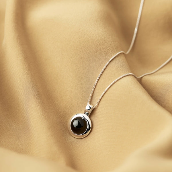Najo - husk round black onyx pendant in sterling silver on fine box chain - 45cm