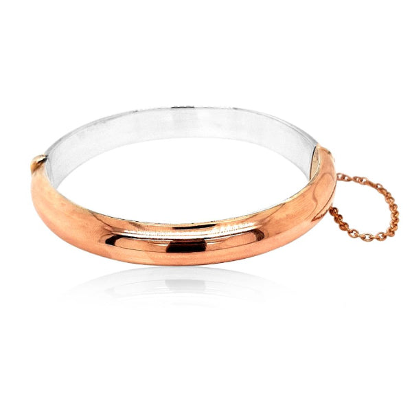 9ct rose gold over silver oval hinged bangle with 9ct rose gold safety chain