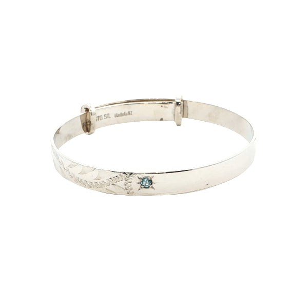 Expanding engraved baby bangle with blue topaz in sterling silver