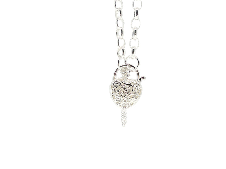 Oval belcher bracelet with filigree heart clast in sterling silver