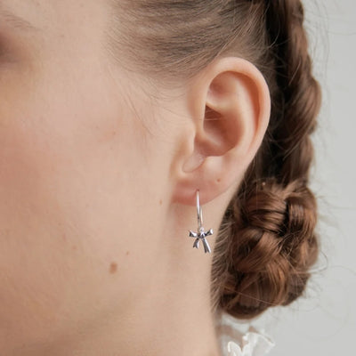 Karen Walker bow sleeper earrings in sterling silver