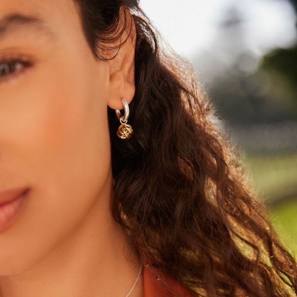 Najo - Nest huggie earrings with gold plated nest bead in sterling silver