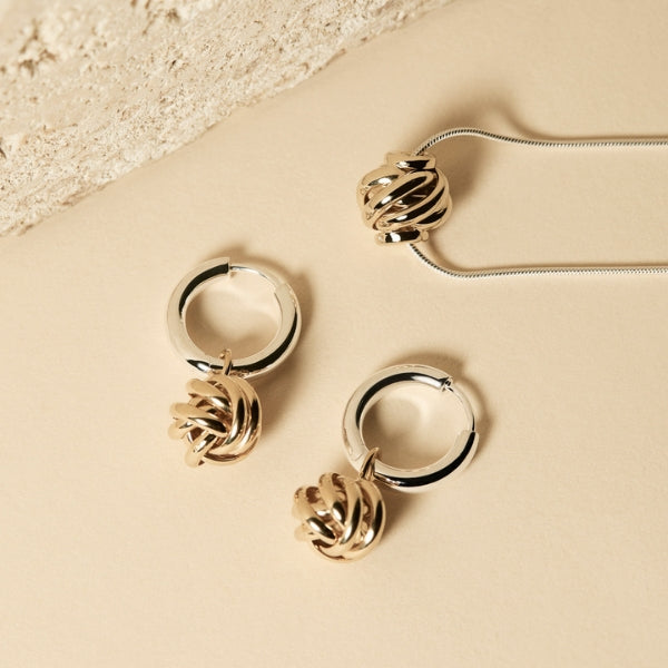 Najo - Nest huggie earrings with gold plated nest bead in sterling silver