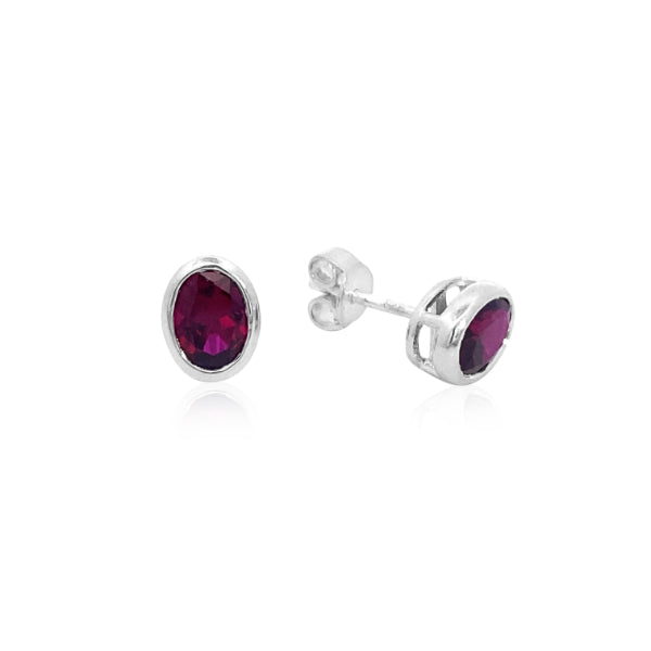 Oval synthetic ruby stud earrings in sterling silver
