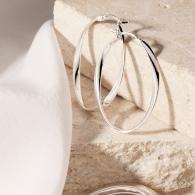 Najo - Cinta ribbon oval hoop earrings in sterling silver