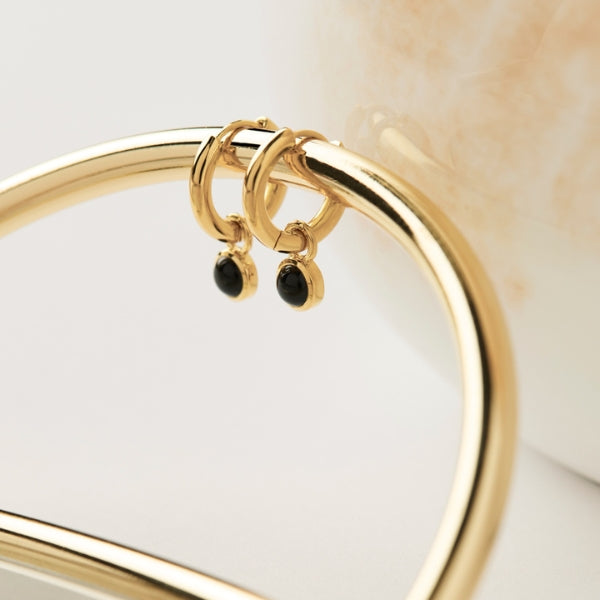 Najo - huggie earrings with onyx drop in gold plated sterling silver