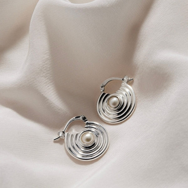Najo - Siren's song spiral disc hoop earrings with fresh water pearl centre in sterling silver