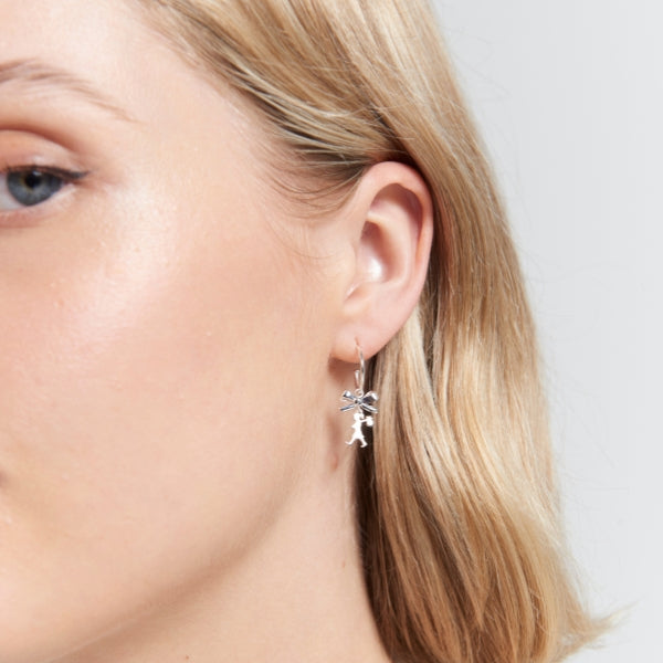 Karen Walker - mini girl with a bow hoops in sterling silver