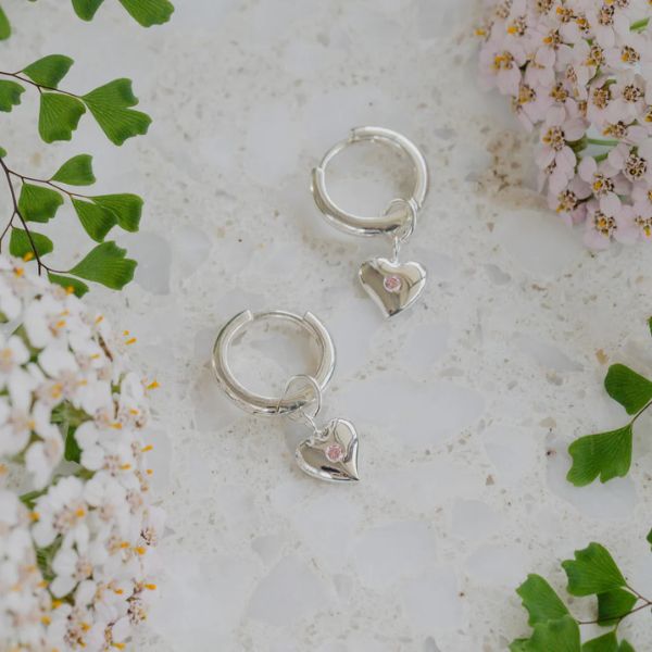 Hopeful heart drops on huggie hoops in silver from Evolve